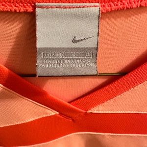 Nike size Large short sleeve shirt. Coral/ pink